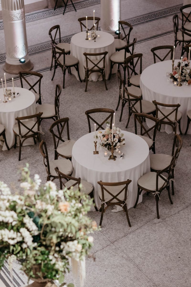 tables and chairs artfully arranged for a wedding inside the new orleans musuem of art