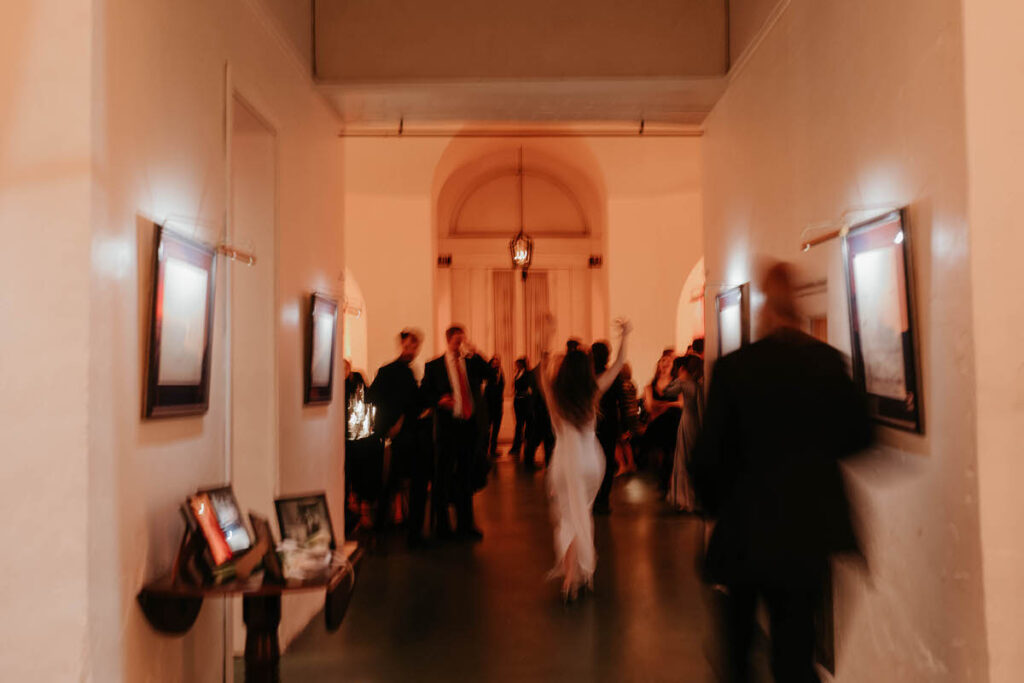 A slightly blurred photo looking into a wedding reception