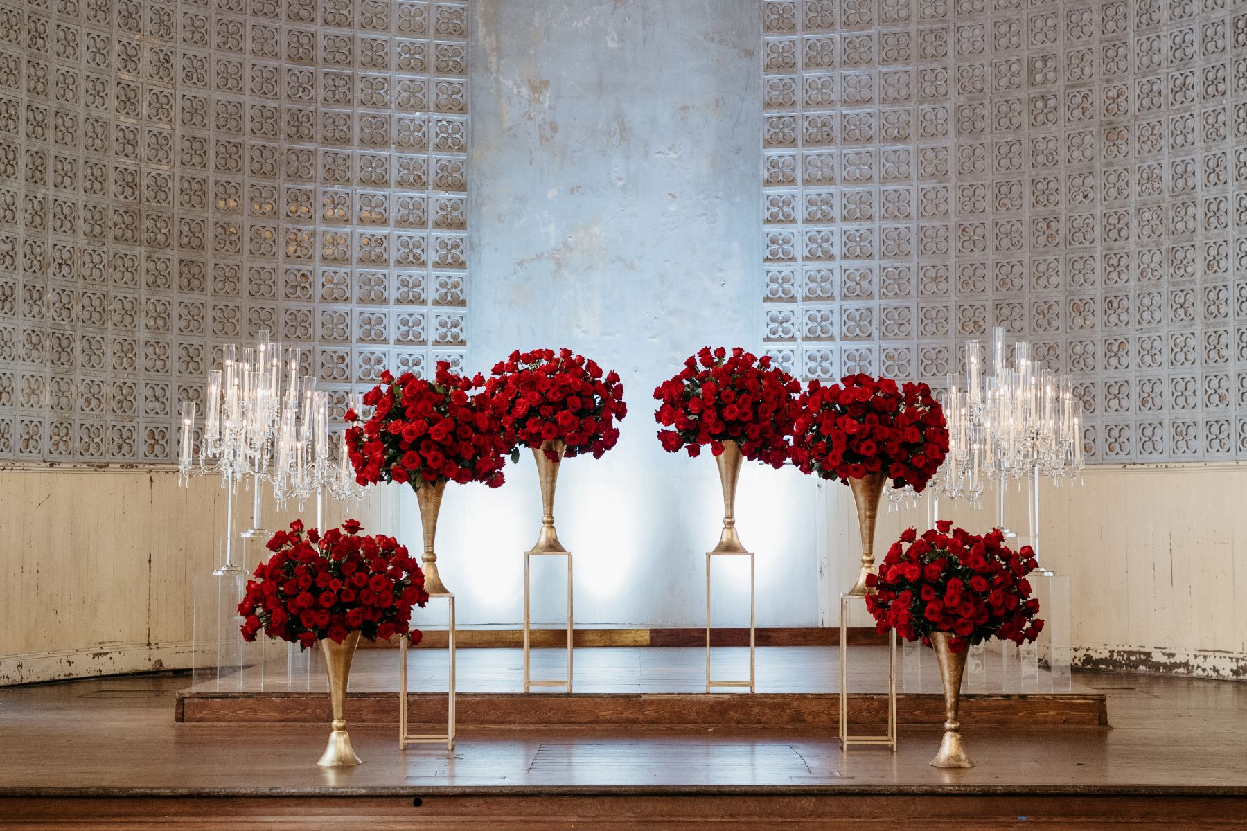 the altar at hotel peter and paul in new orleans decorated with red roses and candles 