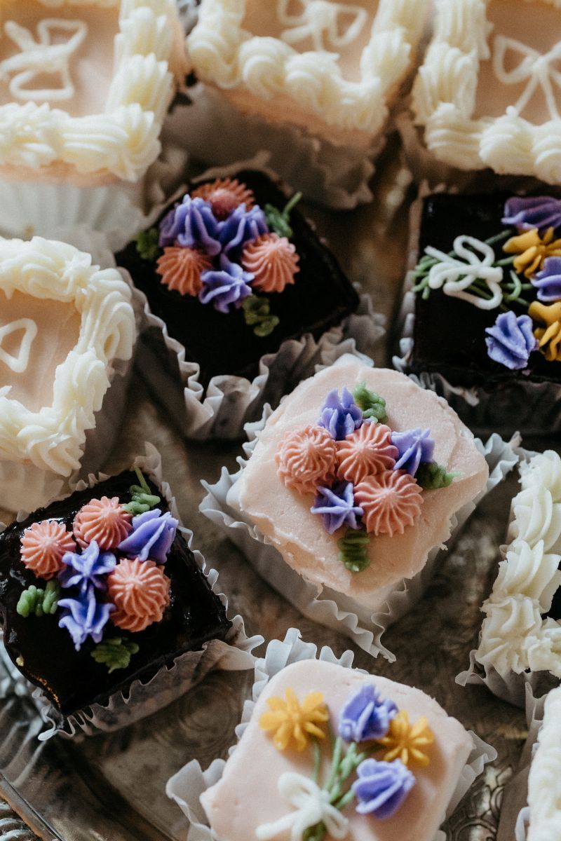 wedding treats on a table decorated with different colors of icing
