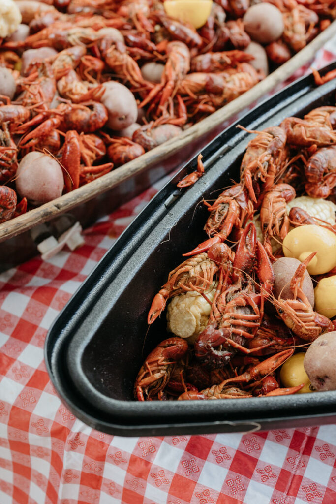 A close up of large bowls holding a crawfish boil 