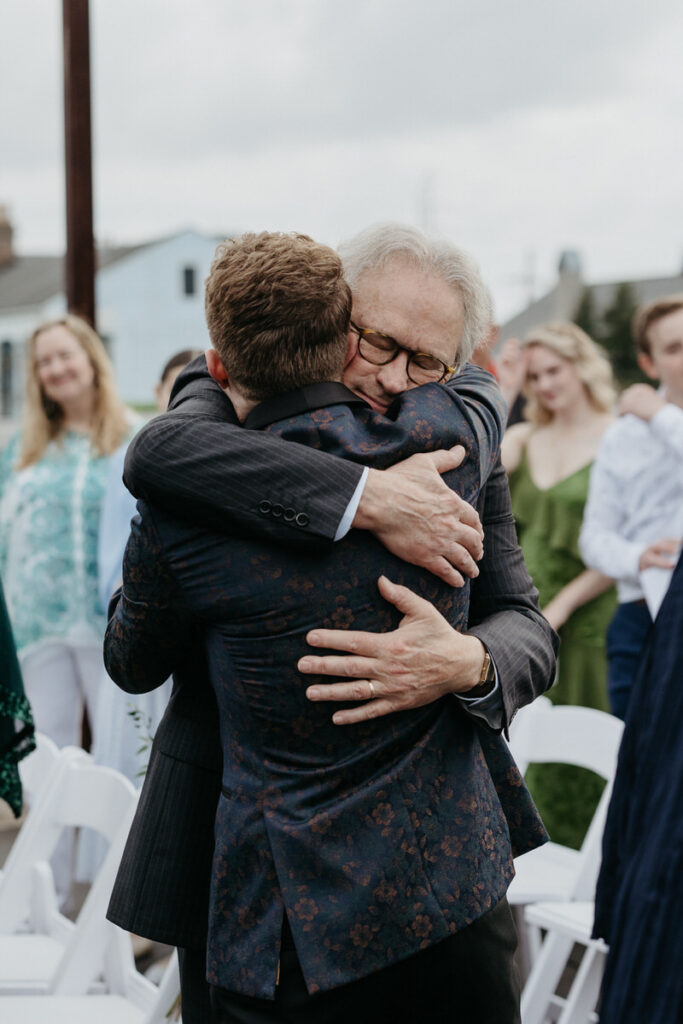 A person hugging their child on their wedding day 