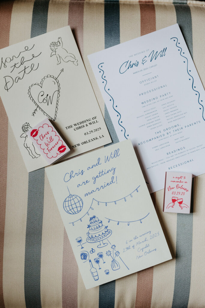 Wedding invitations laid out together on a couch 