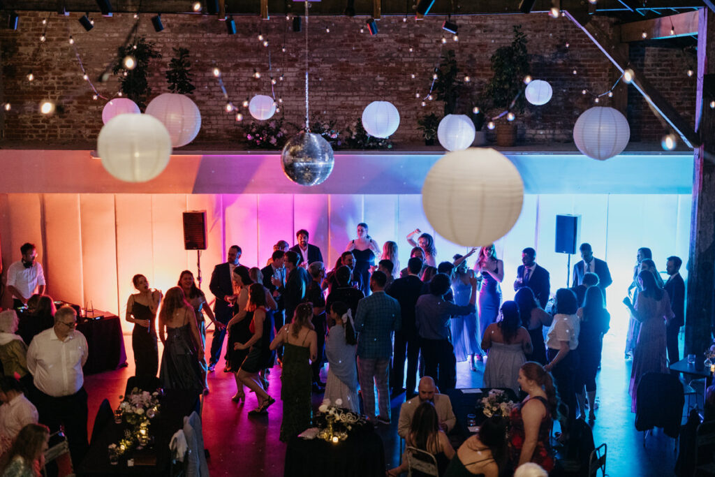 Wedding guests dancing at a reception 