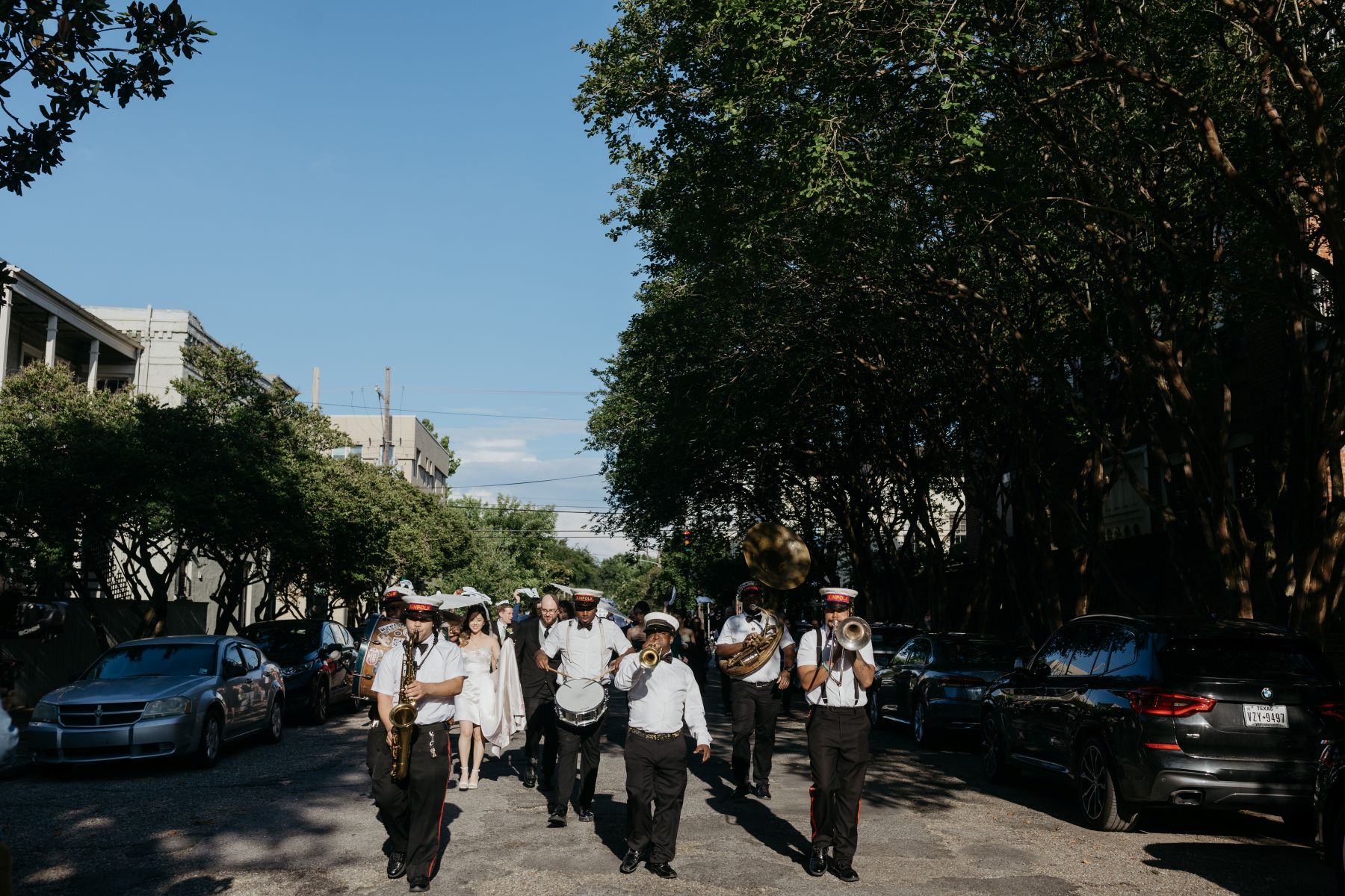 a second line parade in new orleans for a couple's wedding reception