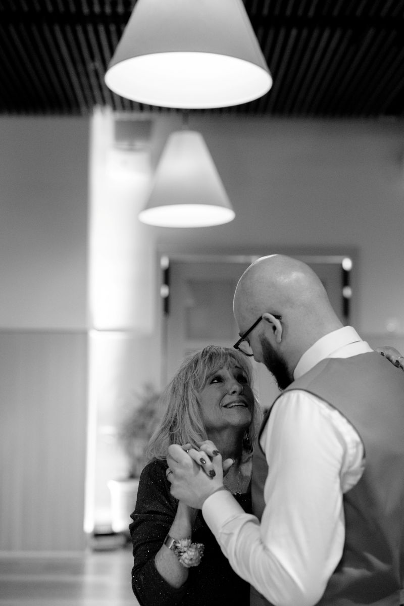 a man dancing with his mother at his wedding reception