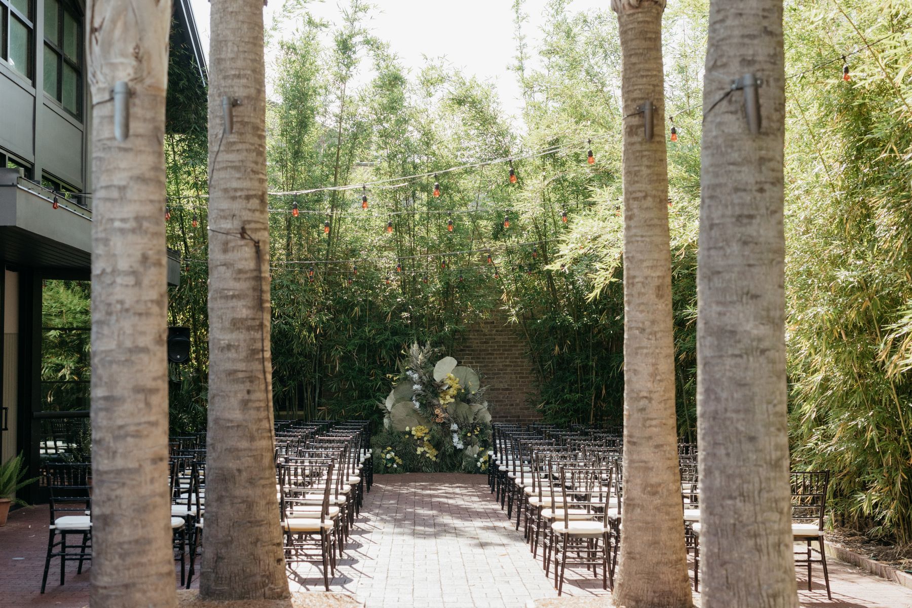 a ceremony site at hotel saint vincent in new orleans set up for a wedding